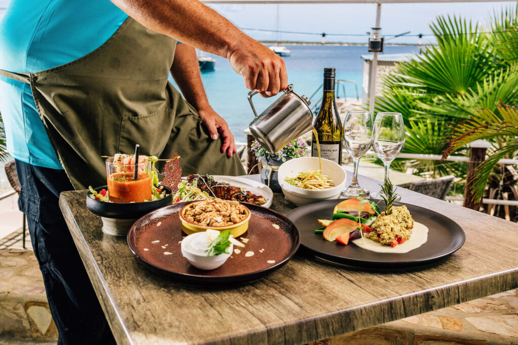 Dinner on Bonaire sunsets, sea breeze, and a table that invites you to stay